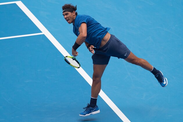 Rafael Nadal of Spain serves during his men's singles quarter-final match against John Isner of the US at the China Open tennis tournament in Beijing on October 6, 2017. / AFP PHOTO / NICOLAS ASFOURI        (Photo credit should read NICOLAS ASFOURI/AFP/Getty Images)
