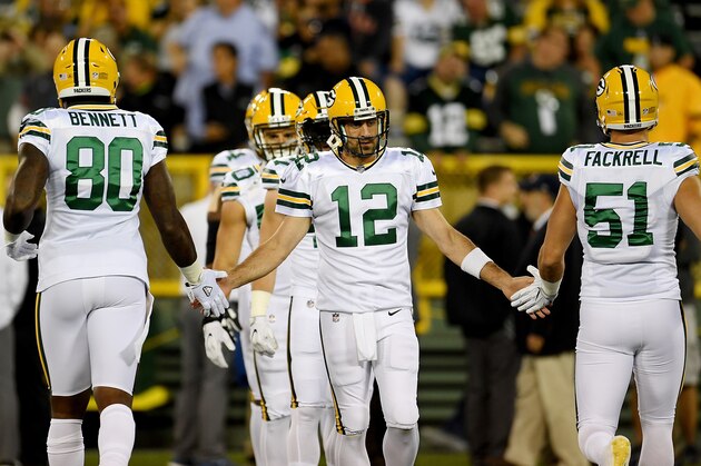 GREEN BAY, WI - SEPTEMBER 28:  Aaron Rodgers #12 of the Green Bay Packers warms up with Martellus Bennett #80 and Kyler Fackrell #51 before the game against the Chicago Bears at Lambeau Field on September 28, 2017 in Green Bay, Wisconsin. (Photo by Stacy Revere/Getty Images)