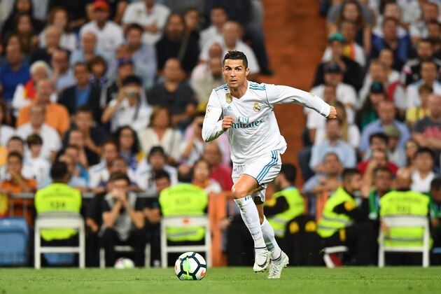 Real Madrid's Portuguese forward Cristiano Ronaldo controls the ball during the Spanish league football match Real Madrid CF vs Espanyol at the Santiago Bernabeu stadium in Madrid on October 1, 2017. / AFP PHOTO / GABRIEL BOUYS        (Photo credit should read GABRIEL BOUYS/AFP/Getty Images)