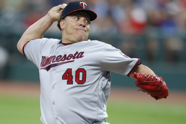 Minnesota Twins starting pitcher Bartolo Colon delivers against the Cleveland Indians during the first inning in a baseball game, Tuesday, Sept. 26, 2017, in Cleveland. (AP Photo/Ron Schwane)