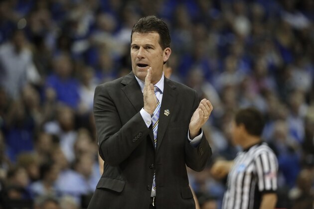 UCLA head coach Steve Alford applauds his team in the first half of an NCAA college basketball tournament South Regional semifinal game against Kentucky Friday, March 24, 2017, in Memphis, Tenn. (AP Photo/Mark Humphrey)