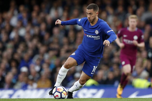 Chelsea's Belgian midfielder Eden Hazard runs with the ball during the English Premier League football match between Chelsea and Manchester City at Stamford Bridge in London on September 30, 2017. / AFP PHOTO / Adrian DENNIS / RESTRICTED TO EDITORIAL USE. No use with unauthorized audio, video, data, fixture lists, club/league logos or 'live' services. Online in-match use limited to 75 images, no video emulation. No use in betting, games or single club/league/player publications.  /         (Photo credit should read ADRIAN DENNIS/AFP/Getty Images)