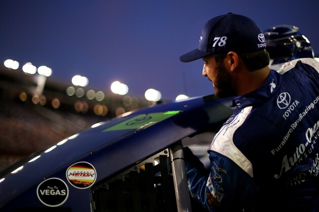 CHARLOTTE, NC - OCTOBER 06: Martin Truex Jr., driver of the #78 Auto-Owners Insurance Toyota, climbs into his car during qualifying for the Monster Energy NASCAR Cup Series Bank of America 500 at Charlotte Motor Speedway on October 6, 2017 in Charlotte, North Carolina.  (Photo by Sarah Crabill/Getty Images)