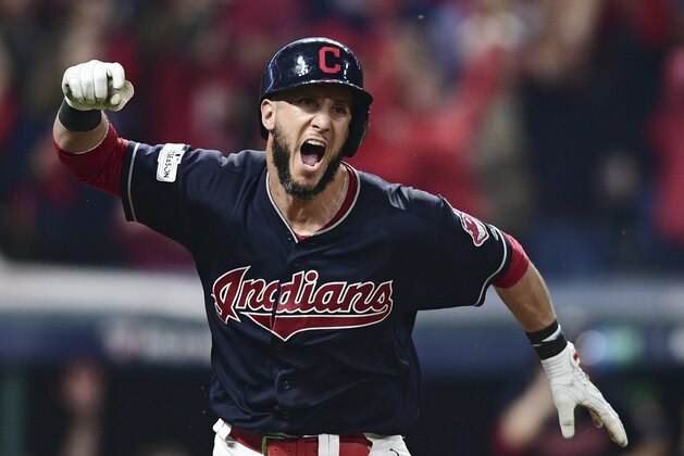 Cleveland Indians' Yan Gomes celebrates after hitting a game-winning single off New York Yankees relief pitcher Dellin Betances in the 13th inning of Game 2 of a baseball American League Division Series, Friday, Oct. 6, 2017, in Cleveland. Austin Jackson scored on the play. The Indians won 9-8. (AP Photo/David Dermer)