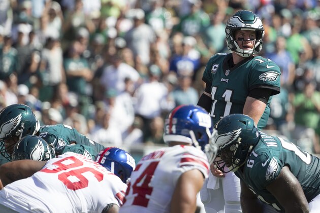 PHILADELPHIA, PA - SEPTEMBER 24: Carson Wentz #11 of the Philadelphia Eagles looks on against Jay Bromley #96 and Olivier Vernon #54 of the New York Giants at Lincoln Financial Field on September 24, 2017 in Philadelphia, Pennsylvania. The Eagles defeated the Giants 27-24. (Photo by Mitchell Leff/Getty Images)