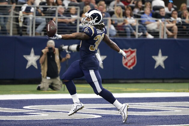 Los Angeles Rams running back Todd Gurley (30) celebrates reaching the end zone for a touchdown in the second half of an NFL football game against the Dallas Cowboys on Sunday, Oct. 1, 2017, in Arlington, Texas. (AP Photo/Michael Ainsworth)