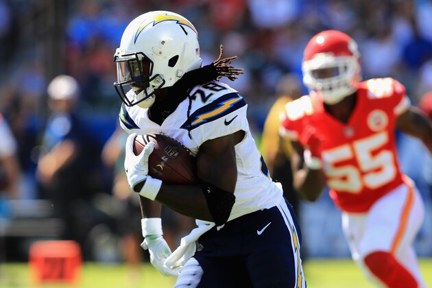 CARSON, CA - SEPTEMBER 24:   Melvin Gordon #28 of the Los Angeles Chargers eludes  Dee Ford #55 of the Kansas City Chiefs on a run play during the first half of a game at StubHub Center on September 24, 2017 in Carson, California.  (Photo by Sean M. Haffey/Getty Images)