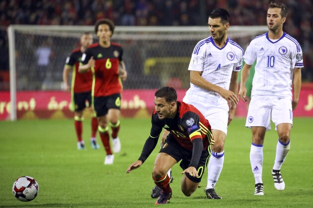 Belgium's Eden Hazard is tackled during their World Cup Group H qualifying soccer match against Bosnia at the King Baudouin stadium in Brussels on Friday, Oct. 7, 2016. (AP Photo/Olivier Matthys)