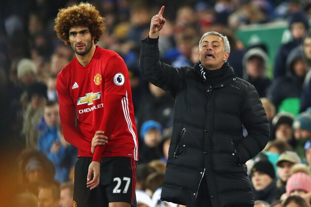 LIVERPOOL, ENGLAND - DECEMBER 04:  Jose Mourinho manager of Manchester United stands alongside substitute Marouane Fellaini of Manchester United during the Premier League match between Everton and Manchester United at Goodison Park on December 4, 2016 in Liverpool, England.  (Photo by Clive Brunskill/Getty Images)