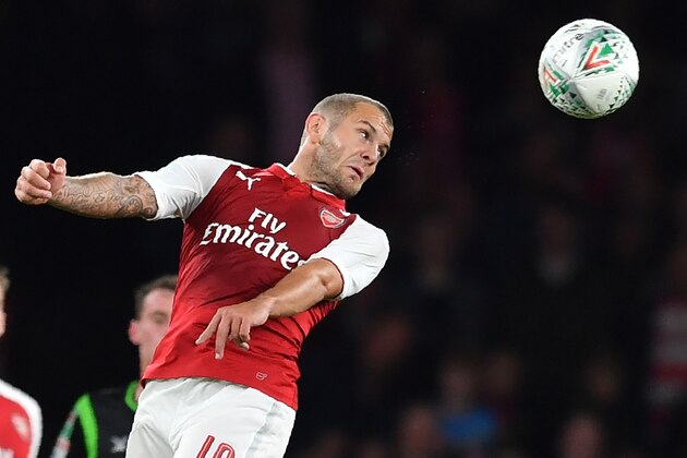 Arsenal's English midfielder Jack Wilshere heads the ball during the English League Cup third round football match between Arsenal and Doncaster Rovers at The Emirates Stadium in London on September 20, 2017. / AFP PHOTO / Ben STANSALL / RESTRICTED TO EDITORIAL USE. No use with unauthorized audio, video, data, fixture lists, club/league logos or 'live' services. Online in-match use limited to 75 images, no video emulation. No use in betting, games or single club/league/player publications.  /         (Photo credit should read BEN STANSALL/AFP/Getty Images)