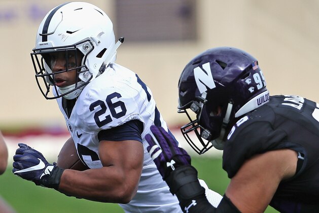 EVANSTON, IL - OCTOBER 07:  Saquon Barkley #26 of the Penn State Nittany Lions is chased by Alex Miller #95 of the Northwestern Wildcats at Ryan Field on October 7, 2017 in Evanston, Illinois.  (Photo by Jonathan Daniel/Getty Images)