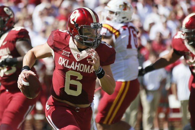 Oklahoma quarterback Baker Mayfield (6) carries for a touchdown in the second quarter of an NCAA college football game against Iowa State in Norman, Okla., Saturday, Oct. 7, 2017. (AP Photo/Sue Ogrocki)