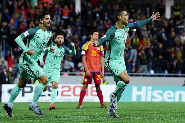 ANDORRA LA VELLA, ANDORRA - OCTOBER 07:  Cristiano Ronaldo (R) of Portugal celebrates with his team mate Andre Silva after scoring the opening goal past the goalkeeper Josep Gomes of Andorraduring the FIFA 2018 World Cup Qualifier between Andorra and Portugal at the Estadi Nacional on October 7, 2017 in Andorra la Vella, Andorra.  (Photo by David Ramos/Getty Images)