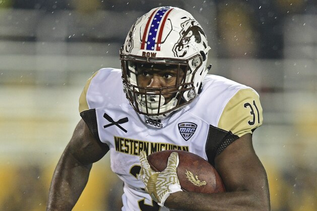 Western Michigan running back Jarvion Franklin carries the ball during the first quarter of the team's NCAA college football game against Kent State, Tuesday, Nov. 8, 2016, in Kent, Ohio. (AP Photo/David Dermer)