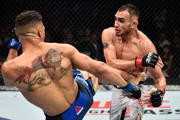 LAS VEGAS, NV - OCTOBER 07:   (L-R) Kevin Lee kicks Tony Ferguson in their interim UFC lightweight championship bout during the UFC 216 event inside T-Mobile Arena on October 7, 2017 in Las Vegas, Nevada. (Photo by Jeff Bottari/Zuffa LLC/Zuffa LLC via Getty Images)
