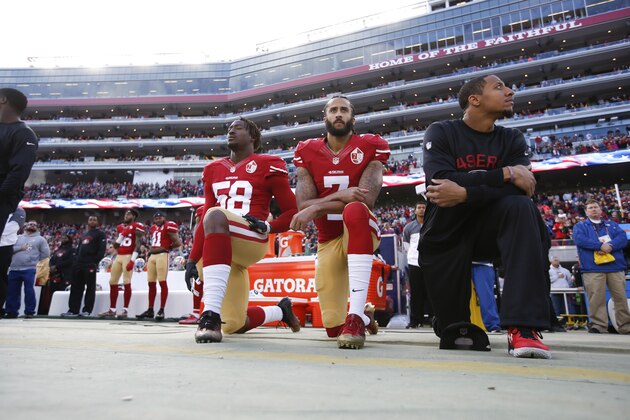 SANTA CLARA, CA - JANUARY 1: Eli Harold #58, Colin Kaepernick #7 and Eric Reid #35 of the San Francisco 49ers kneel on the sideline, during the anthem, prior to the game against the Seattle Seahawks at Levi Stadium on January 1, 2017 in Santa Clara, California. The Seahawks defeated the 49ers 25-23. (Photo by Michael Zagaris/San Francisco 49ers/Getty Images) SANTA CLARA, CA - JANUARY 1: Eli Harold #58, Colin Kaepernick #7 and Eric Reid #35 of the San Francisco 49ers kneel on the sideline, during the anthem, prior to the game against the Seattle Seahawks at Levi Stadium on January 1, 2017 in Santa Clara, California. The Seahawks defeated the 49ers 25-23. (Photo by Michael Zagaris/San Francisco 49ers/Getty Images)