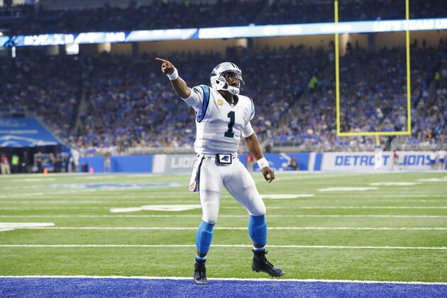 Carolina Panthers quarterback Cam Newton reacts after throwing a 31-yard touchdown pass to wide receiver Kelvin Benjamin during the second half of an NFL football game against the Detroit Lions, Sunday, Oct. 8, 2017, in Detroit. (AP Photo/Paul Sancya)