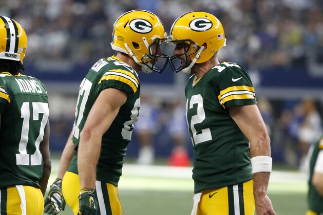 Green Bay Packers' Jordy Nelson, left, and Aaron Rodgers (12) celebrate a touchdown catch by Nelson in the second half of an NFL football game against the Dallas Cowboys on Sunday, Oct. 8, 2017, in Arlington, Texas. (AP Photo/Michael Ainsworth)