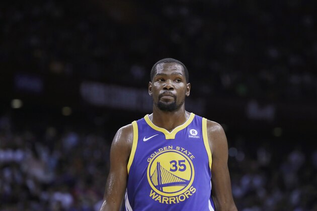 Golden State Warriors' Kevin Durant looks on during the basketball match of the 2017 NBA Global Games against Minnesota Timberwolves in Shenzhen, south China's Guangdong province, Thursday, Oct. 5, 2017. (AP Photo/Kin Cheung)