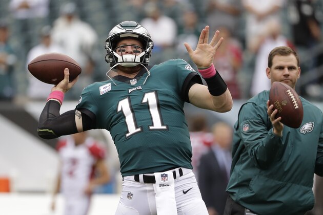Philadelphia Eagles' Carson Wentz warms-up before an NFL football game against the Arizona Cardinals, Sunday, Oct. 8, 2017, in Philadelphia. (AP Photo/Michael Perez)