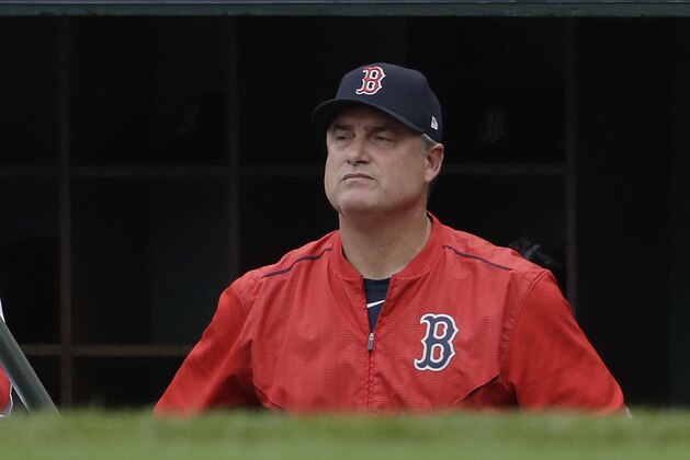 Boston Red Sox manager John Farrell watches from the dugout during the second inning in Game 3 of baseball's American League Division Series against the Houston Astros, Sunday, Oct. 8, 2017, in Boston. (AP Photo/Charles Krupa)