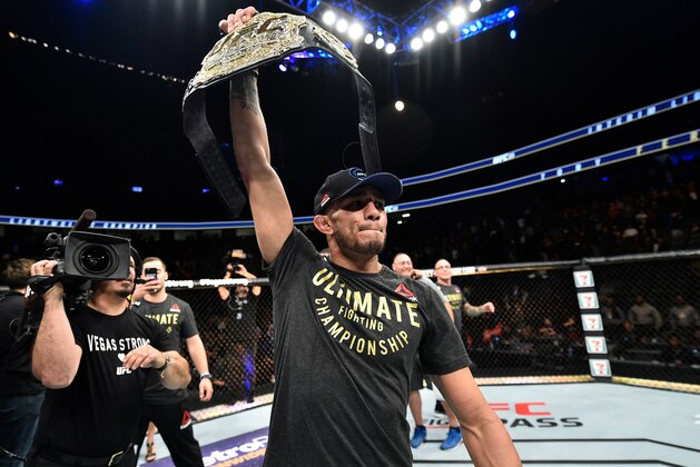 LAS VEGAS, NV - OCTOBER 07:   Tony Ferguson celebrates after his submission victory over Kevin Lee in their interim UFC lightweight championship bout during the UFC 216 event inside T-Mobile Arena on October 7, 2017 in Las Vegas, Nevada. (Photo by Jeff Bottari/Zuffa LLC/Zuffa LLC via Getty Images)