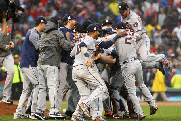 BOSTON, MA - OCTOBER 09:  The Houston Astros celebrate defeating the Boston Red Sox 5-4 in game four of the American League Division Series at Fenway Park on October 9, 2017 in Boston, Massachusetts. The Houston Astros advance to the American League Championship Series.  (Photo by Maddie Meyer/Getty Images)