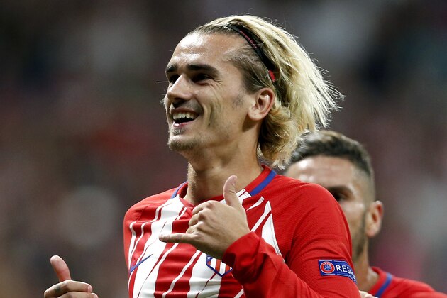 Atletico's Antoine Griezmann, front, celebrates after scoring the penalty opening goal during a Champions League group C soccer match between Atletico Madrid and Chelsea at the Wanda Metropolitano stadium in Madrid, Spain, Wednesday, Sept. 27, 2017. (AP Photo/Francisco Seco) Atletico's Antoine Griezmann, front, celebrates after scoring the penalty opening goal during a Champions League group C soccer match between Atletico Madrid and Chelsea at the Wanda Metropolitano stadium in Madrid, Spain, Wednesday, Sept. 27, 2017. (AP Photo/Francisco Seco)
