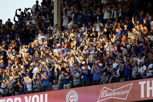 CHICAGO, IL - OCTOBER 09:  Fans cheer in the seventh inning during game three of the National League Division Series between the Washington Nationals and the Chicago Cubs at Wrigley Field on October 9, 2017 in Chicago, Illinois. (Photo by Jonathan Daniel/Getty Images)