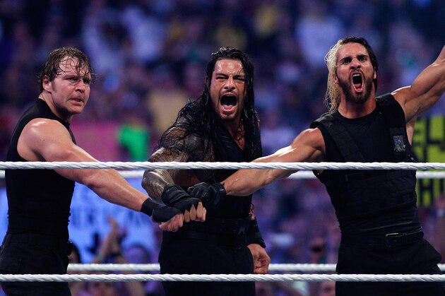 The Shield reacts after their win during Wrestlemania XXX at the Mercedes-Benz Super Dome in New Orleans on Sunday, April 6, 2014. (Jonathan Bachman/AP Images for WWE)