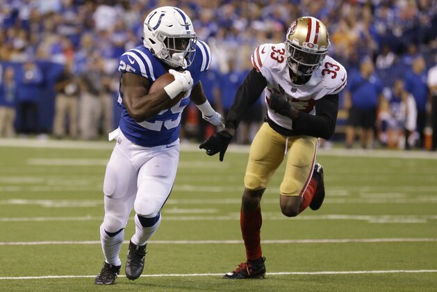 Indianapolis Colts' Marlon Mack (25) runs against San Francisco 49ers' Rashard Robinson during the second half of an NFL football game, Sunday, Oct. 8, 2017, in Indianapolis. (AP Photo/Michael Conroy)