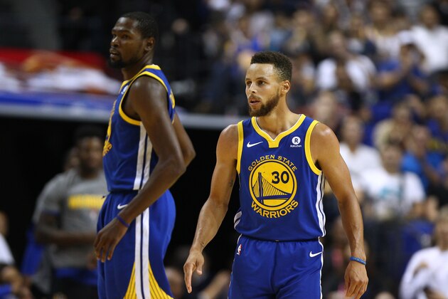 SHANGHAI, CHINA - OCTOBER 08: Stephen Curry #30 and Kevin Durant #35 of the Golden State Warriors look on during the game between the Minnesota Timberwolves and the Golden State Warriors as part of 2017 NBA Global Games China at Mercedes-Benz Arena on October 8, 2017 in Shanghai, China. (Photo by Zhong Zhi/Getty Images)