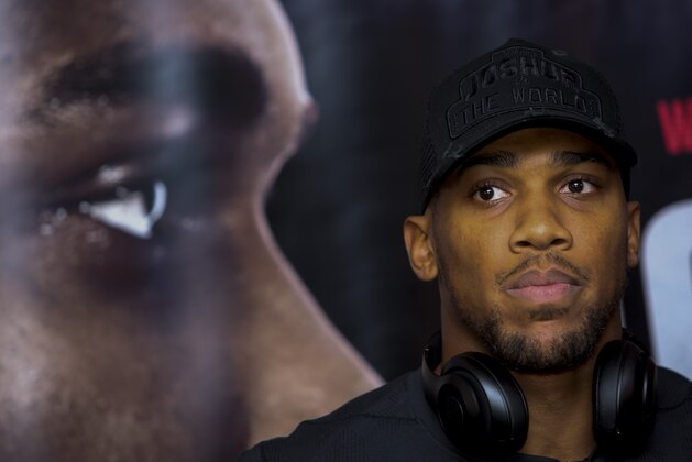 Britain's Anthony Joshua is seen during a press conference at the Principality Stadium in Cardiff on September 11, 2017 during an event to promote his heavyweight world title boxing match against Bulgaria's Kubrat Pulev. 
Britain's Anthony Joshua will defend his IBO, IBF and WBA world heavyweight titles against Bulgaria's Kubrat Pulev at Cardiff's Principality Stadium on October 28.
 / AFP PHOTO / Geoff CADDICK        (Photo credit should read GEOFF CADDICK/AFP/Getty Images)