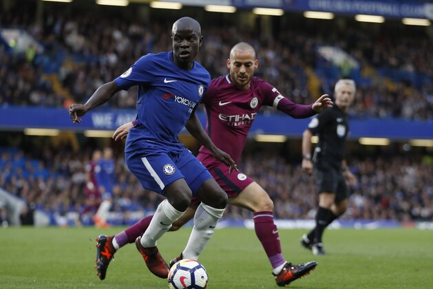 Chelsea's N'Golo Kante, left, challenges Manchester City's David Silva during their English Premier League soccer match between Chelsea and Manchester City at Stamford Bridge stadium in London, Saturday, Sept. 30, 2017. (AP Photo/Kirsty Wigglesworth)