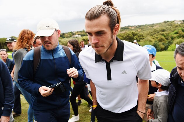 SOTOGRANDE, SPAIN - APRIL 17:  Real Madrid and Wales footballer Gareth Bale looks on as he follows Sergio Garcia's group during the final round on day four of the Open de Espana at Real Club Valderrama on April 17, 2016 in Sotogrande, Spain.  (Photo by Ross Kinnaird/Getty Images)
