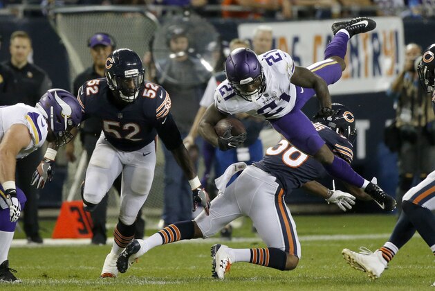 CHICAGO, IL - OCTOBER 09:  Jerick McKinnon #21 of the Minnesota Vikings is hit by  Adrian Amos #38 of the Chicago Bears in the second quarter at Soldier Field on October 9, 2017 in Chicago, Illinois.  (Photo by Jon Durr/Getty Images)