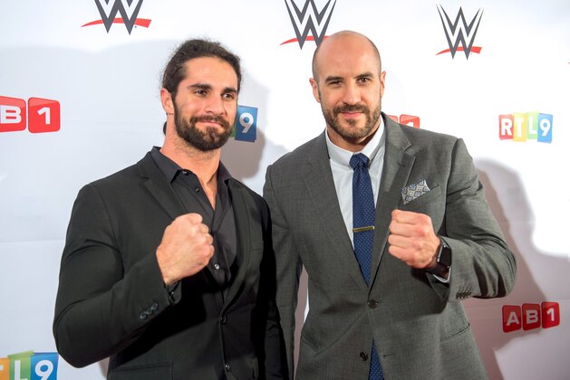 US wrestler Seth Rollins (L) and Swiss wrestler Cesaro (R) pose before the World Wrestling Entertainment (WWE) show at the Zenith Arena on May 9, 2017 in Lille.  / AFP PHOTO / PHILIPPE HUGUEN        (Photo credit should read PHILIPPE HUGUEN/AFP/Getty Images)