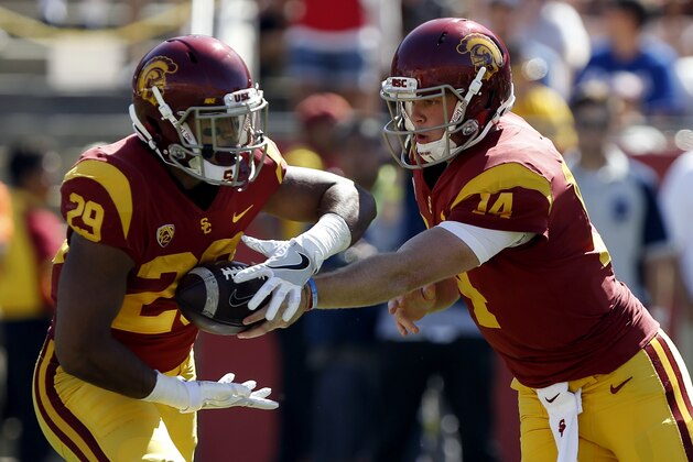 Southern California quarterback Sam Darnold, right, hands off to running back Vavae Malepeai during the first half of an NCAA college football game against Oregon State in Los Angeles, Saturday, Oct. 7, 2017. (AP Photo/Alex Gallardo)