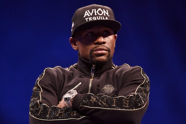 LAS VEGAS, NV - AUGUST 25:  Floyd Mayweather Jr. sits onstage during a news conference after Mayweather's 10th-round TKO victory in their super welterweight boxing match on August 26, 2017 at T-Mobile Arena in Las Vegas, Nevada. (Photo by Jeff Bottari/Zuffa LLC/Zuffa LLC via Getty Images)
