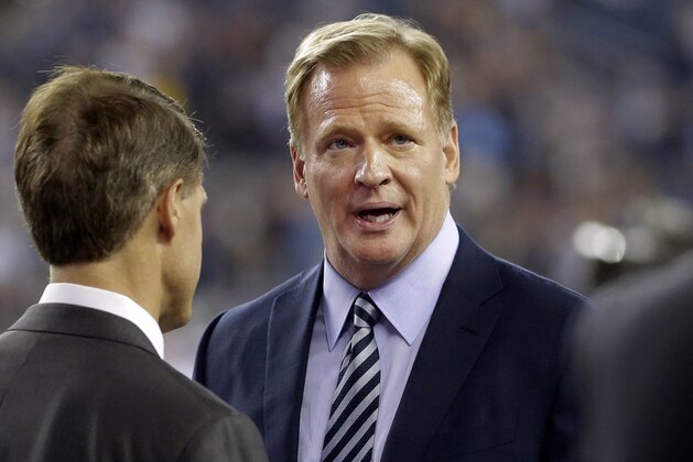 NFL Commissioner Roger Goodell talks with Kansas City Chiefs Chairman and CEO Clark Hunt, left, as they walk onto the field before an NFL football game between the New England Patriots and the Chiefs, Thursday, Sept. 7, 2017, in Foxborough, Mass. (AP Photo/Steven Senne)