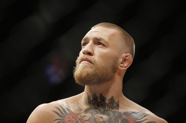 Conor McGregor fights Nate Diaz during their welterweight mixed martial arts bout at UFC 202 on Saturday, Aug. 20, 2016, in Las Vegas. McGregor won by split decision. (AP Photo/Isaac Brekken)