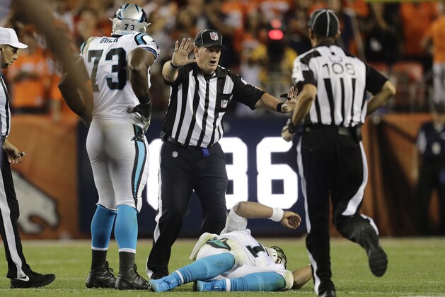 Carolina Panthers quarterback Cam Newton (1) lies on the turf after a roughing the passer penalty on Denver Broncos free safety Darian Stewart during the second half of an NFL football game, Thursday, Sept. 8, 2016, in Denver. The Broncos won 21-20. (AP Photo/Joe Mahoney)