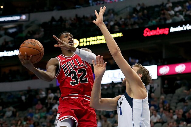 DALLAS, TX - OCTOBER 04: Kris Dunn #32 of the Chicago Bulls shoots against Dirk Nowitzki #41 of the Dallas Mavericks in the first half at American Airlines Center on October 4, 2017 in Dallas, Texas. NOTE TO USER: User expressly acknowledges and agrees that, by downloading and or using this photograph, User is consenting to the terms and conditions of the Getty Images License Agreement. (Photo by Tom Pennington/Getty Images) DALLAS, TX - OCTOBER 04: Kris Dunn #32 of the Chicago Bulls shoots against Dirk Nowitzki #41 of the Dallas Mavericks in the first half at American Airlines Center on October 4, 2017 in Dallas, Texas. NOTE TO USER: User expressly acknowledges and agrees that, by downloading and or using this photograph, User is consenting to the terms and conditions of the Getty Images License Agreement. (Photo by Tom Pennington/Getty Images)