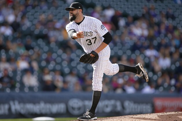 DENVER, CO - SEPTEMBER 17:   Pat Neshek #37 of the Colorado Rockies pitches during a regular season MLB game between the Colorado Rockies and the visiting San Diego Padres at Coors Field on September 17, 2017 in Denver, Colorado. (Photo by Russell Lansford/Getty Images)