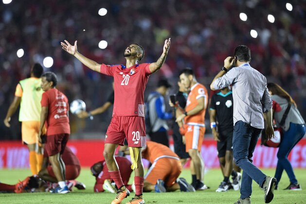 Panama player Anibal Godoy (C-L) and teammates celebrate after qualifying for the World Cup for the first time ever, in their qualifier football match Costa Rica in Panama City, on October 10, 2017. / AFP PHOTO / Rodrigo ARANGUA        (Photo credit should read RODRIGO ARANGUA/AFP/Getty Images)