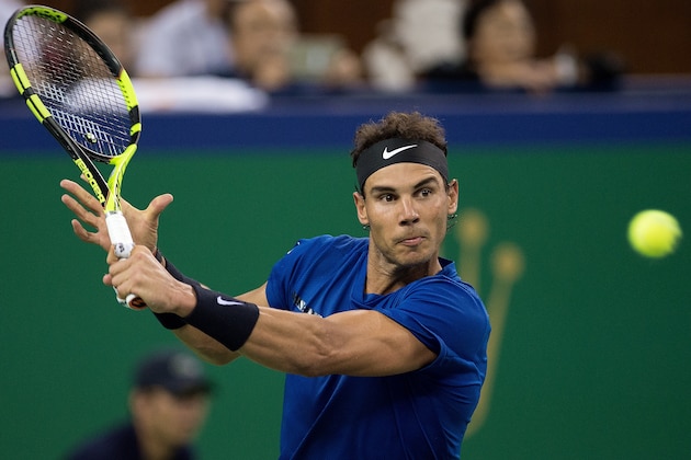Rafael Nadal of Spain hits a return during the men's 2nd round singles match against Jared Donaldson of the US at the Shanghai Masters tennis tournament in Shanghai on October 11, 2017. / AFP PHOTO / NICOLAS ASFOURI        (Photo credit should read NICOLAS ASFOURI/AFP/Getty Images)