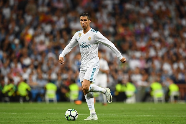 Real Madrid's Portuguese forward Cristiano Ronaldo controls the ball during the Spanish league football match Real Madrid CF vs Espanyol at the Santiago Bernabeu stadium in Madrid on October 1, 2017. / AFP PHOTO / GABRIEL BOUYS        (Photo credit should read GABRIEL BOUYS/AFP/Getty Images)