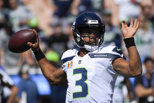 Seattle Seahawks quarterback Russell Wilson warms up before an NFL football game against the Los Angeles Rams Sunday, Oct. 8, 2017, in Los Angeles. (AP Photo/Mark J. Terrill)