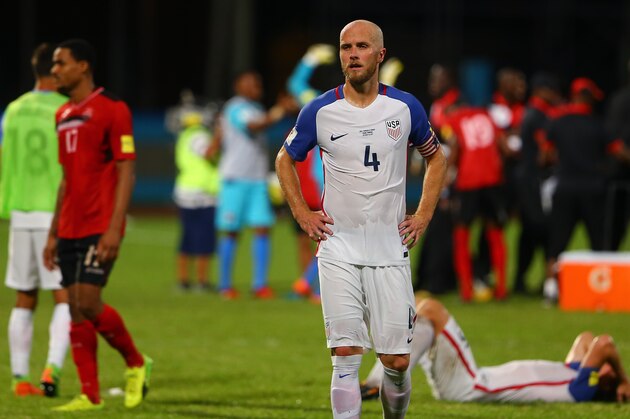 COUVA, TRINIDAD AND TOBAGO - OCTOBER 10: A contrast of emotions as captain Michael Bradley (C) of the United States mens national team reacts as Trinidad and Tobago pull of a win during the FIFA World Cup Qualifier match between Trinidad and Tobago at the Ato Boldon Stadium on October 10, 2017 in Couva, Trinidad And Tobago. (Photo by Ashley Allen/Getty Images)