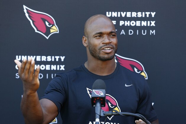 New Arizona Cardinals running back Adrian Peterson answers a question during an NFL football news conference at the team's training facility Wednesday, Oct. 11, 2017, in Tempe, Ariz. (AP Photo/Ross D. Franklin)